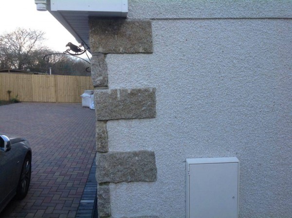 Brown granite corner stones used on wall