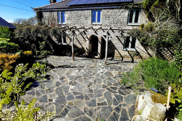 Blue grey crazy paving outside the front of a house