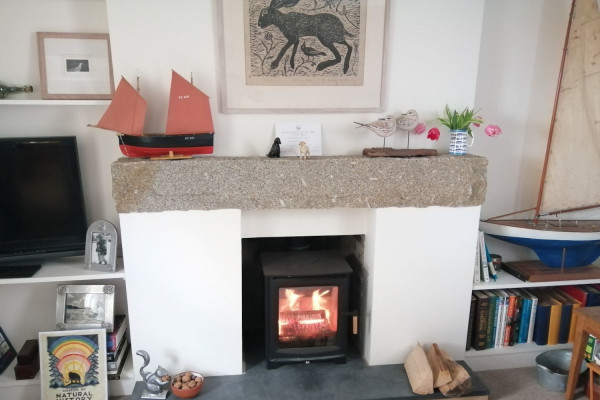 Brown granite lintel above a fireplace