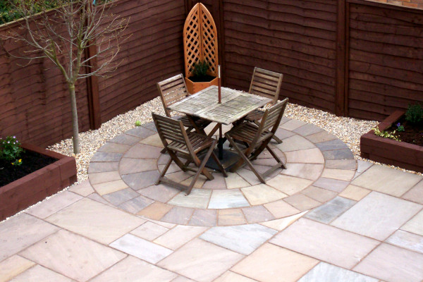 Brown sandstone paving slabs used to create this patio seating area