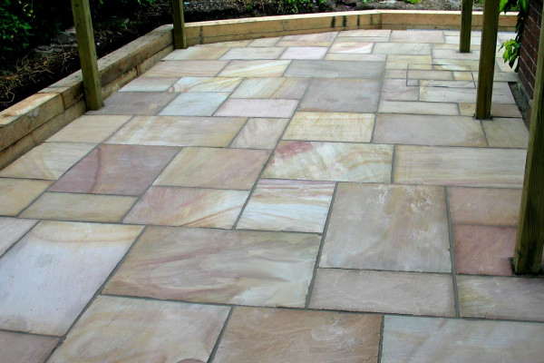 Buff sandstone paving slabs used to create this seating area