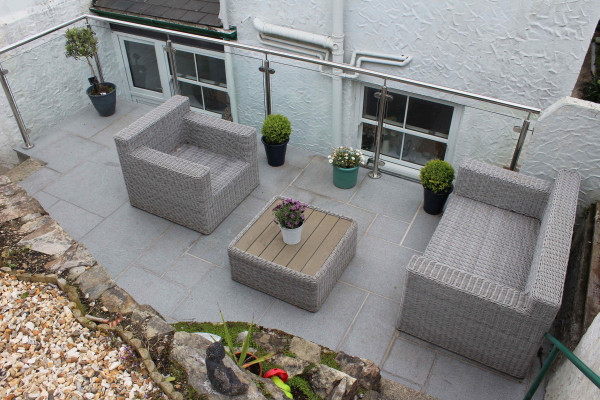 Dark Grey granite paving slabs in an outside room