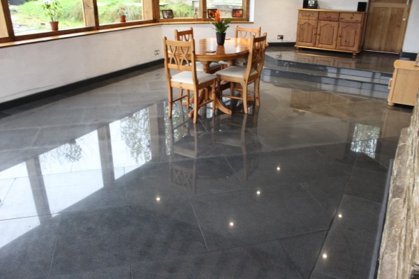 Dark grey granite paving tile, with a polished surface 