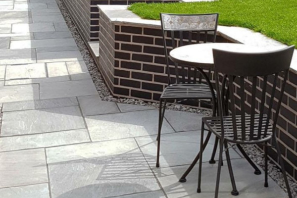 Grey sandstone paving used to create this patio sitting area