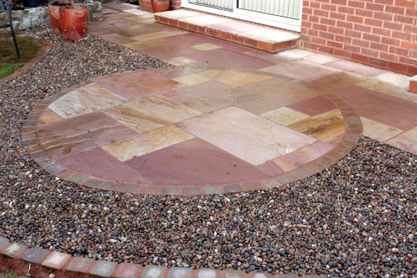 Red sandstone paving slabs used to create this patio paving area