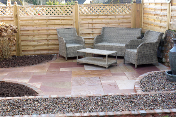 Red sandstone paving slabs used to create a patio paving. 