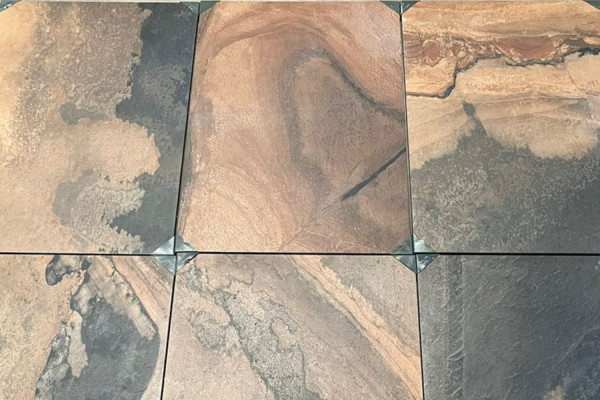 Rustic porcelain paving slabs used on a patio area