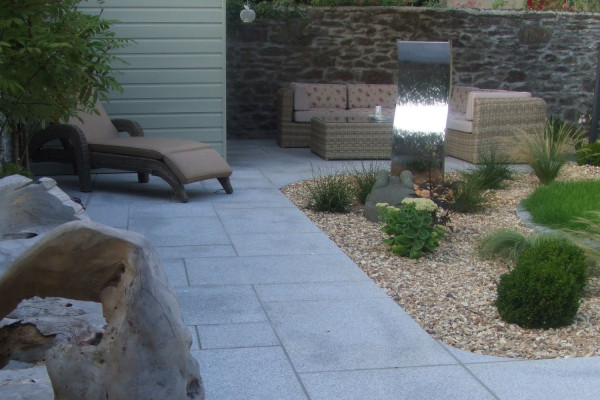 Silver grey granite paving slabs used on a patio paving area