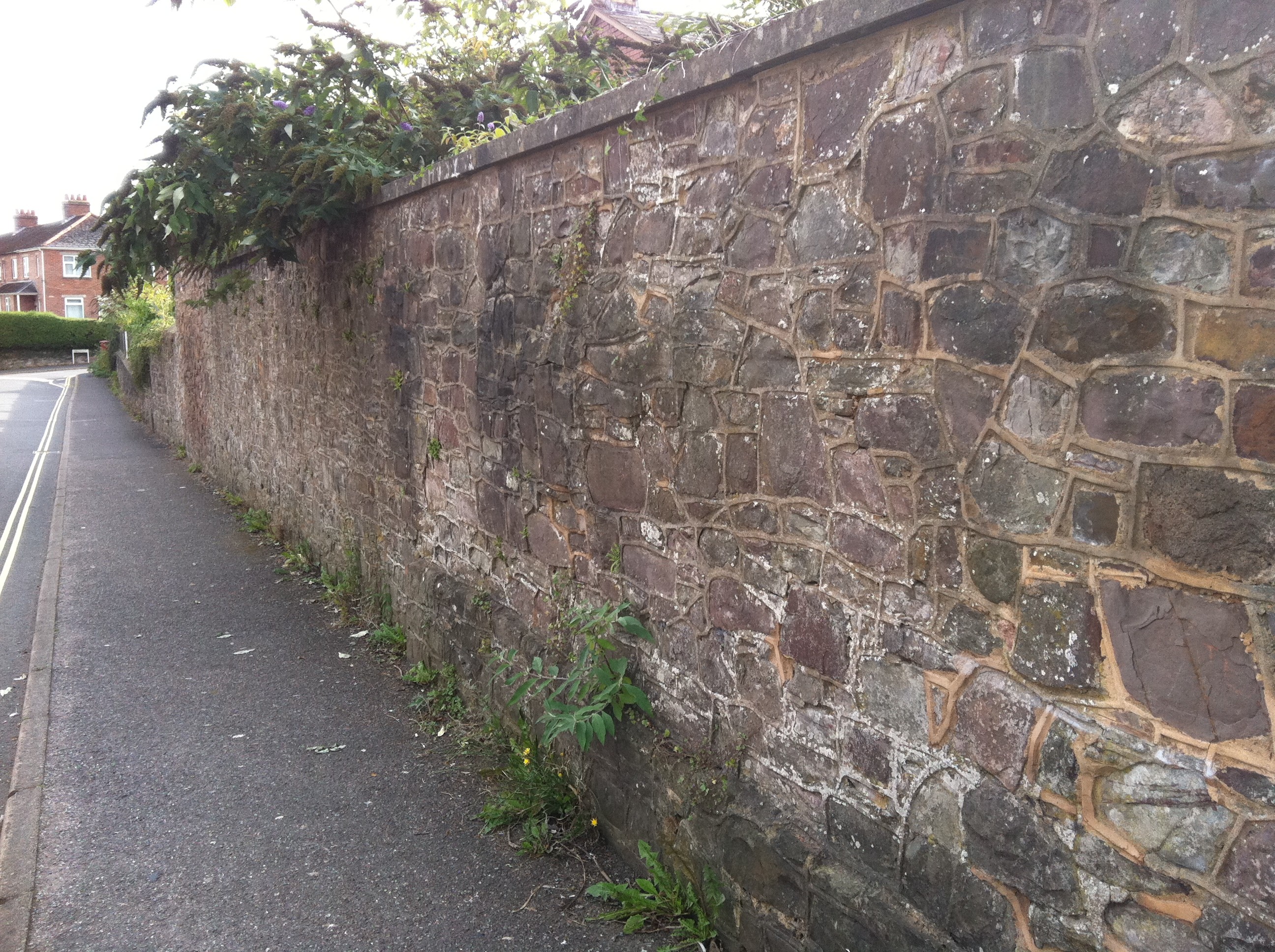 Red sandstone walling used on a mortared wall 
