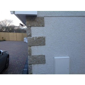 Brown granite corner stones used on wall