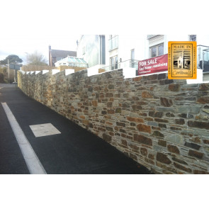 A mixture of rustic cut stone and blue grey cut stone on this wall