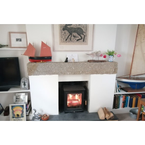 Brown granite lintel above a fireplace