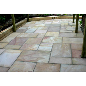 Buff sandstone paving slabs used to create this seating area