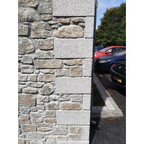 Dressed granite quoins used on the end of a building