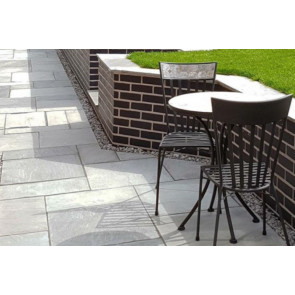 Grey sandstone paving used to create this patio sitting area
