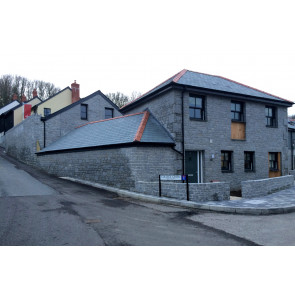 Grey granite stone used to face a building 