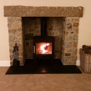 Brown granite lintel above a fireplace