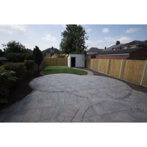 Heritage brown porcelain paving used to create this patio