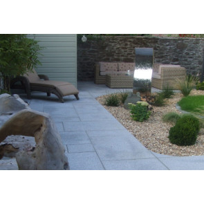 Silver grey granite paving slabs used on a patio paving area