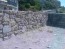 Random granite walling stone used on wall at Seaton