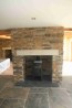 Rustic cut stone used on an interior fireplace
