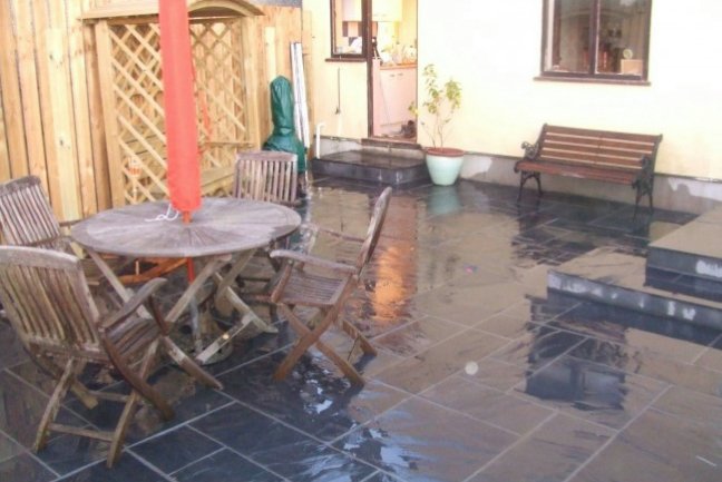 Slate paving slabs in garden 